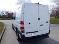 A 2016 Mercedes-Benz Sprinter van in white with a cargo style rear, featuring the Mercedes-Benz logo and a plain back door design