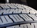 Close-up of a tire tread from a 2016 Mercedes-Benz Sprinter showing detailed patterns and grooves designed for traction and stability