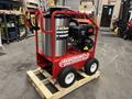 2024 Magnum 4000 Hot Water Pressure Washer mounted on a wooden pallet with a red frame a silver water tank and a black engine on the side