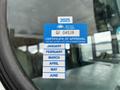 A blue and white sticker displaying a certificate of approval for a 2013 International 4200 showing the year 2025 and months listed from January to June