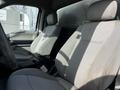 Interior of a 2018 Ford F-550 with two gray cloth seats visible in the foreground