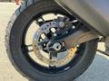 Close-up of the rear wheel of a 2021 Harley-Davidson RA1250 S showcasing the brake caliper disc and tire details