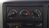 Dashboard controls for climate and ventilation of a 2005 International 4300 featuring knobs for fan speed temperature and air direction