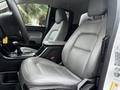 Interior view of a 2018 Chevrolet Colorado showing the driver's seat and center console equipped with a gear shifter and storage compartment