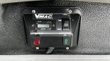 Control panel for a VMAC vehicle mounted air compressor featuring a switch for power and indicator lights for operation and temperature